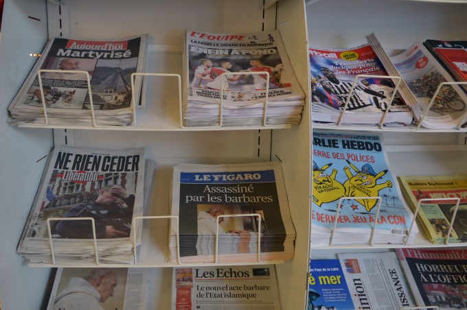 Newspaper headlines the morning after the priest was murdered