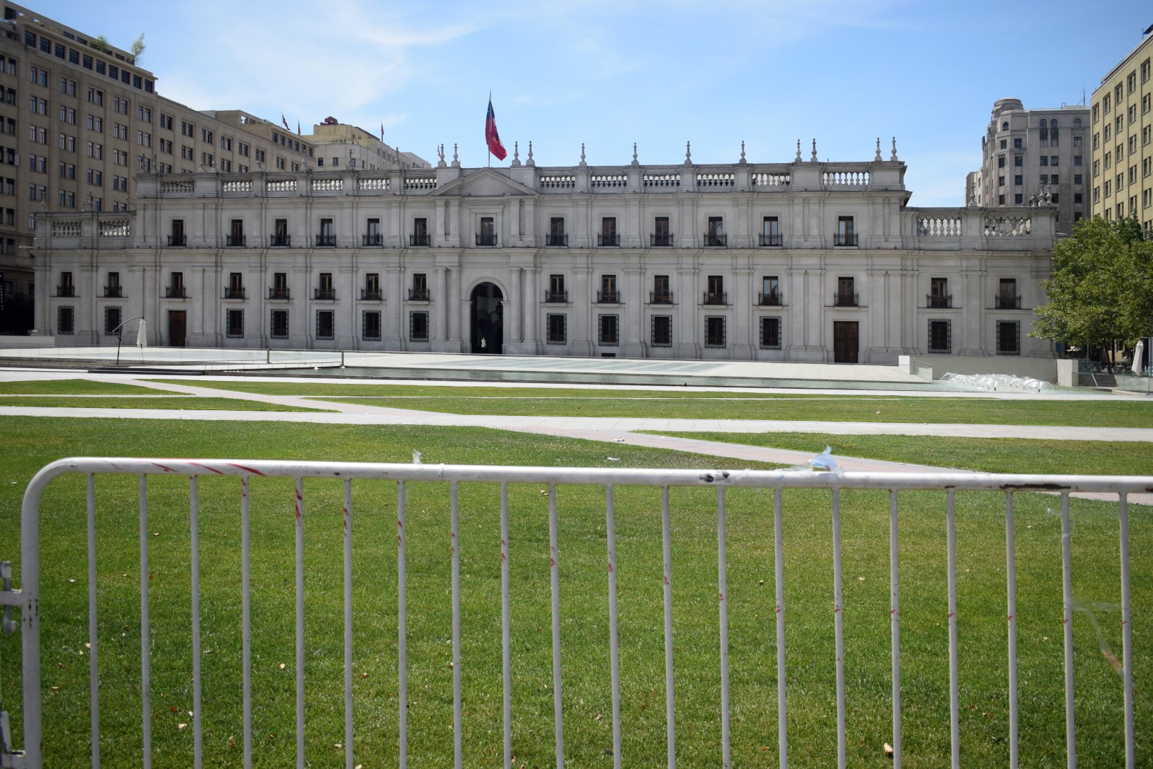 Meanwhile, La Moneda, seat of the President of the Republic of Chile, is still standing... but fenced off