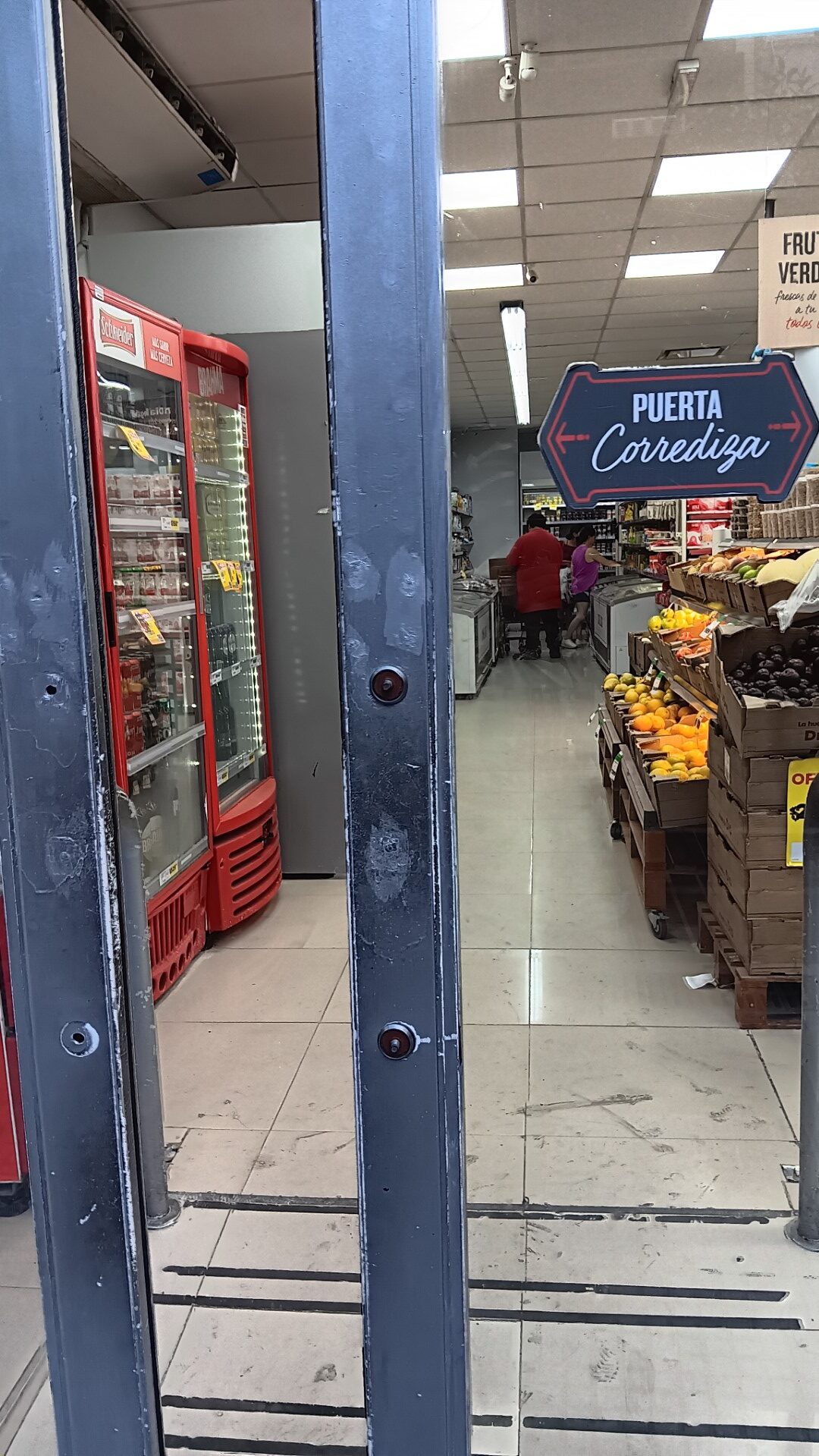 Your typical supermarket door, not automatic and heavy