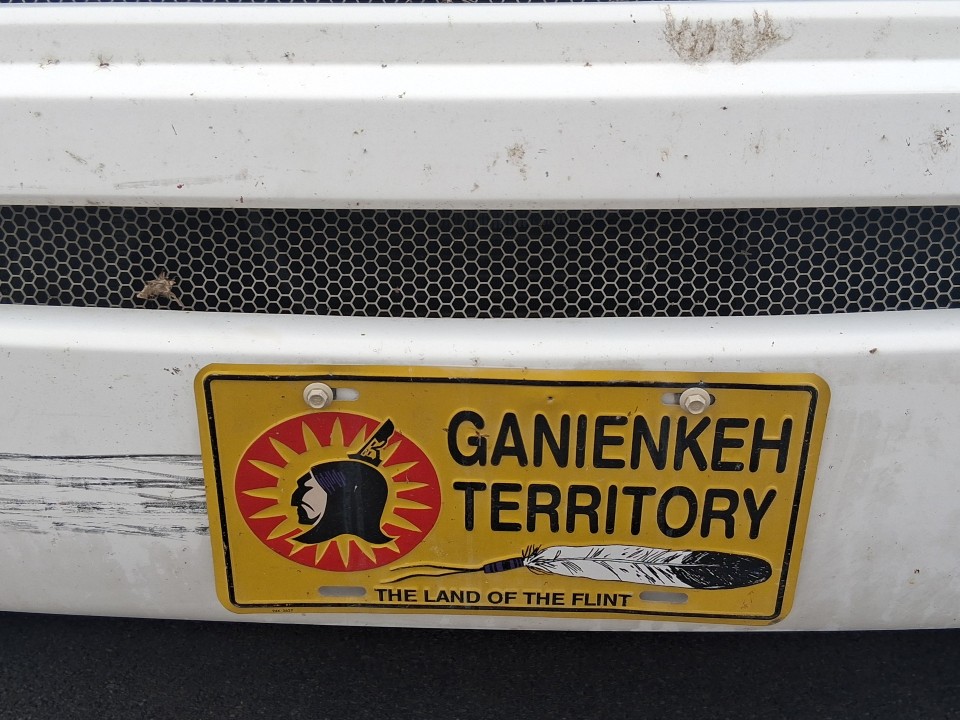 Ganienkeh Territory plate, referring to the sovereign Mohawk community in northern New York — Akwesasne International Powwow, Sept. 13, 2026, Lamoureux Park, Cornwall, Ontario, Canada