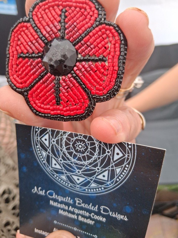 Beaded poppy by Mohawk artist Natasha Arquette-Cooke at the Akwesasne International Powwow — Sept. 13, 2026, Lamoureux Park, Cornwall, Ontario, Canada