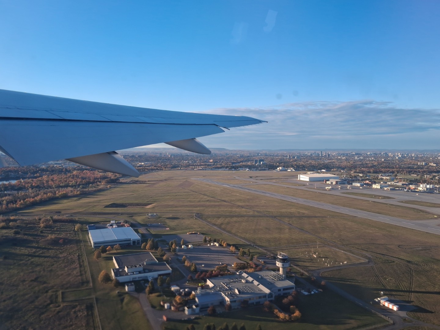 Taking off from Ottawa Macdonald-Cartier International Airport, with the runways, hangars and control tower below — Oct. 17, 2026, Ottawa, Ontario, Canada