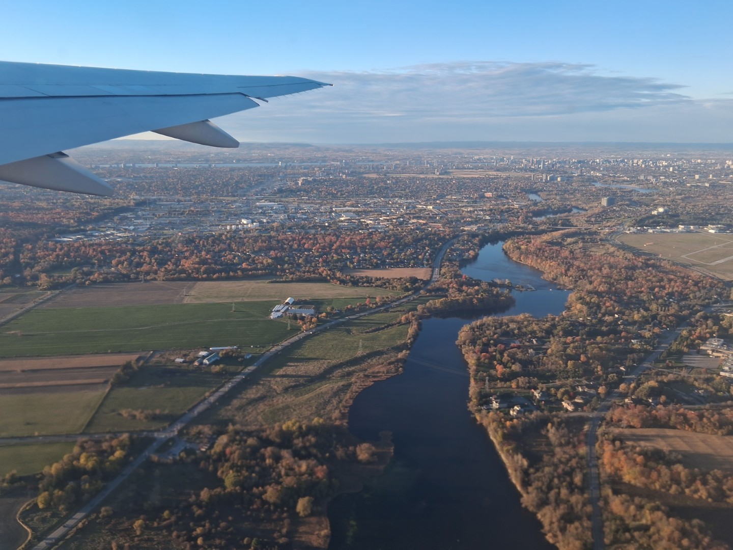 The Rideau River, surrounded by fields and trees in their fall colours — Oct. 17, 2026, Ottawa, Ontario, Canada