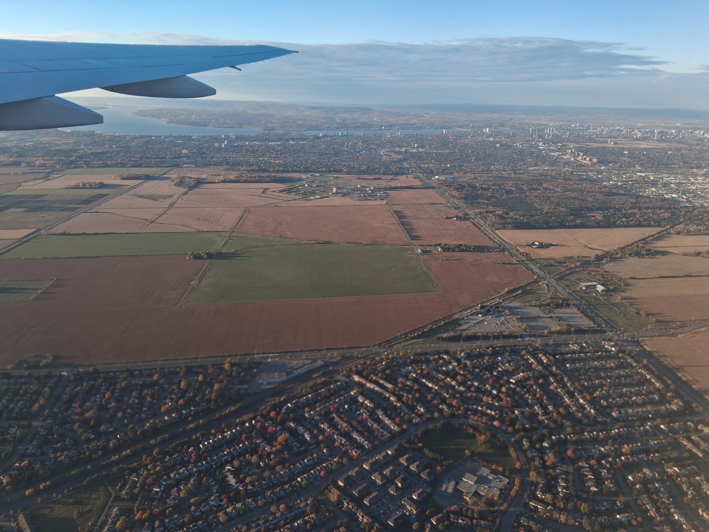 Farmland along Woodroffe Avenue, with Barrhaven in the foreground — Oct. 17, 2026, Nepean, Ottawa, Ontario, Canada