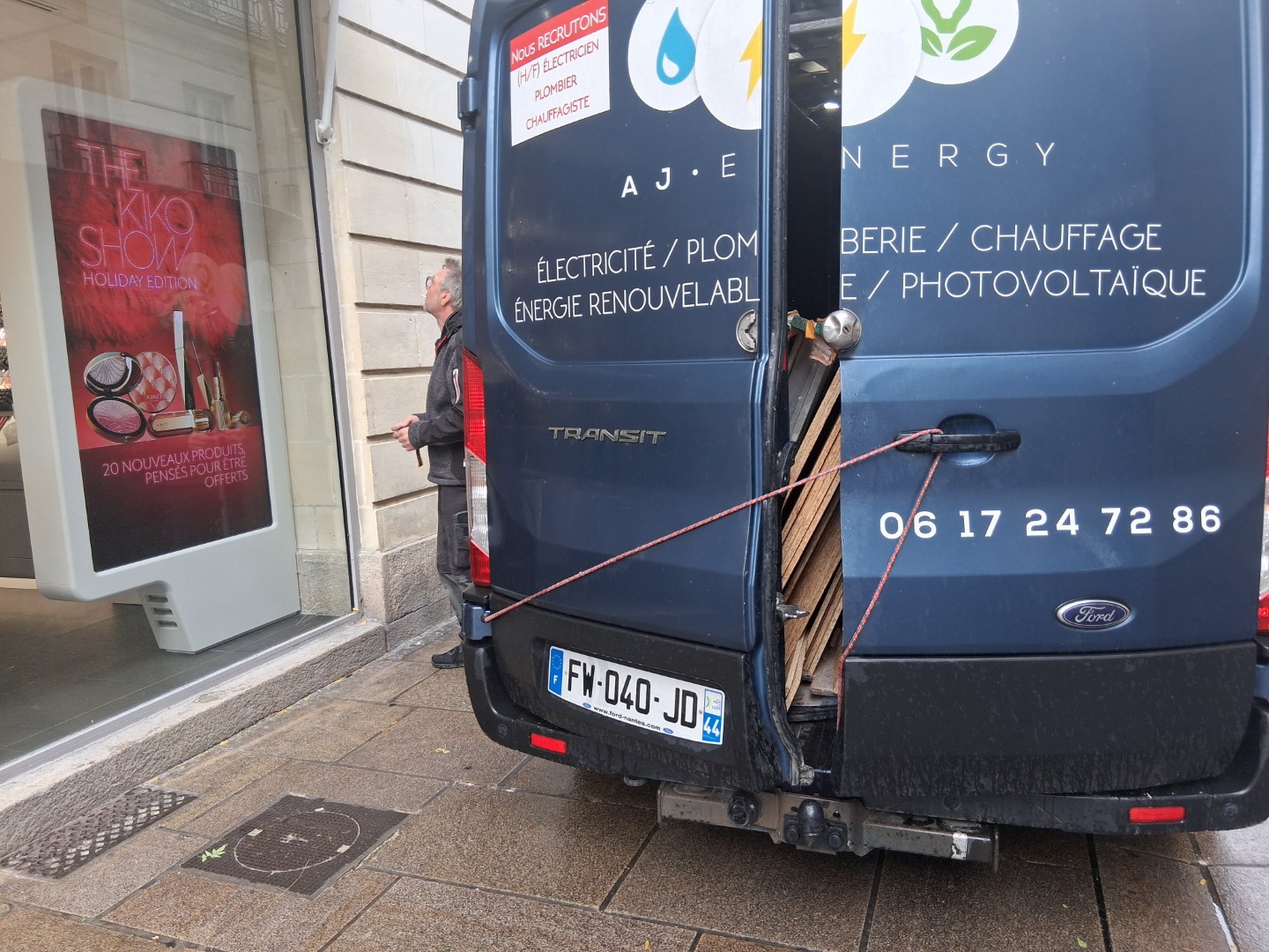 Workers boarding up a storefront — Oct. 22, 2026, Nantes, Pays de la Loire, France