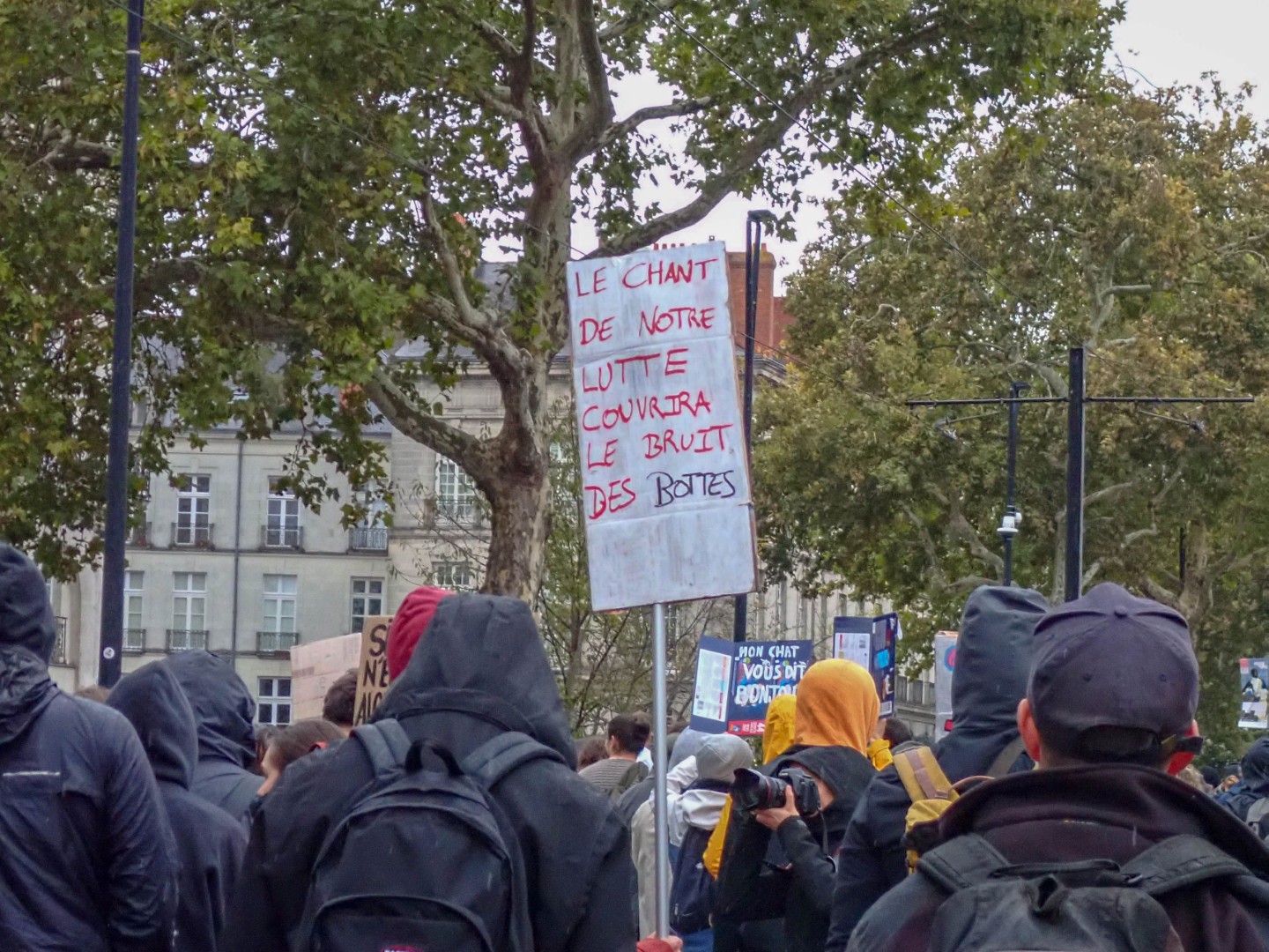 Our song of resistance will drown out the jackboots, a sign above the crowd — Oct. 24, 2026, Cours des 50 Otages, Nantes, Pays de la Loire, France
