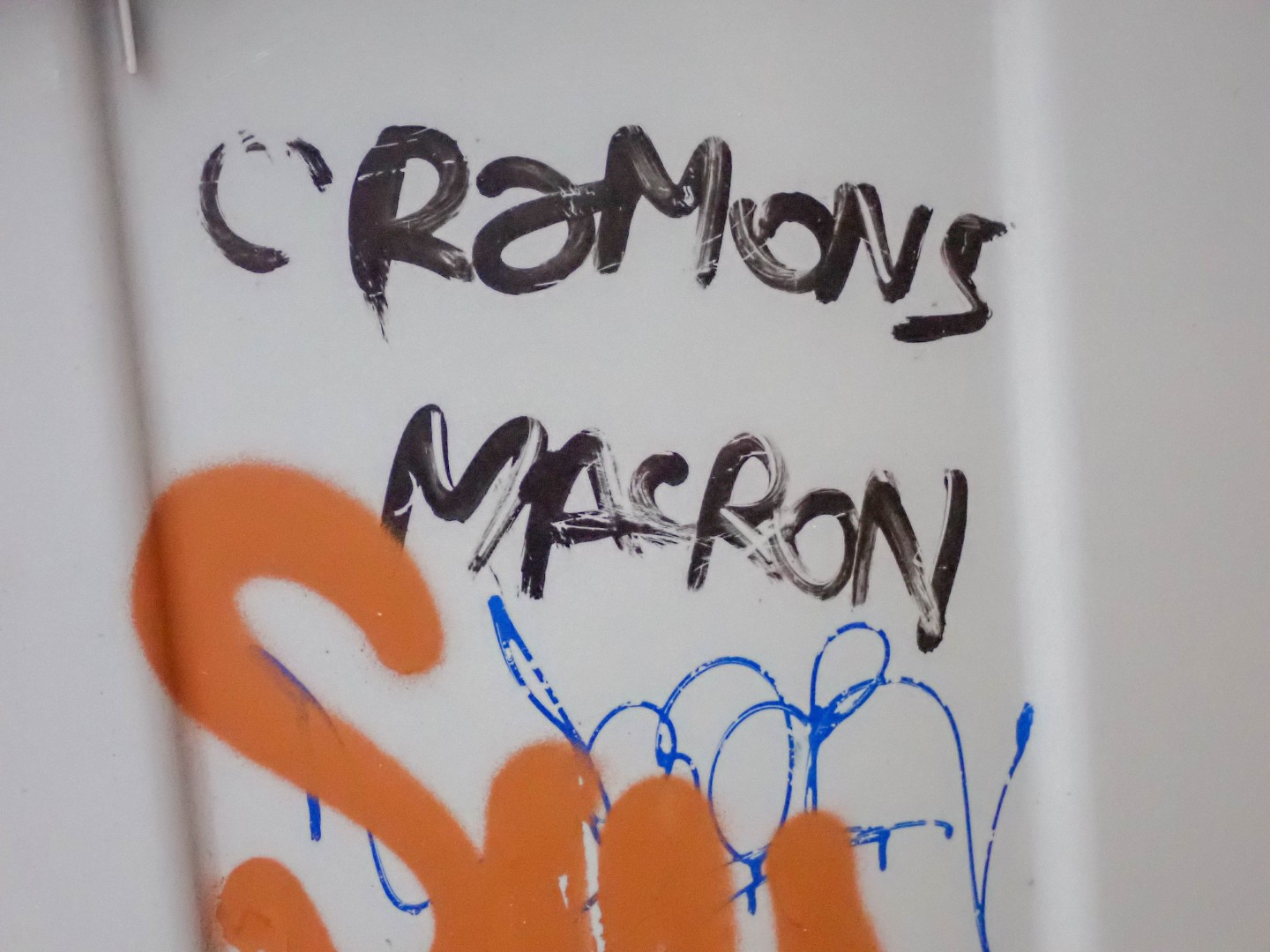 Cramons Macron (Let’s burn Macron), graffiti on a garbage can — Oct. 24, 2026, Nantes, Pays de la Loire, France